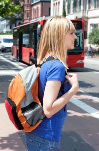 41566514 - blonde female student waiting for the bus